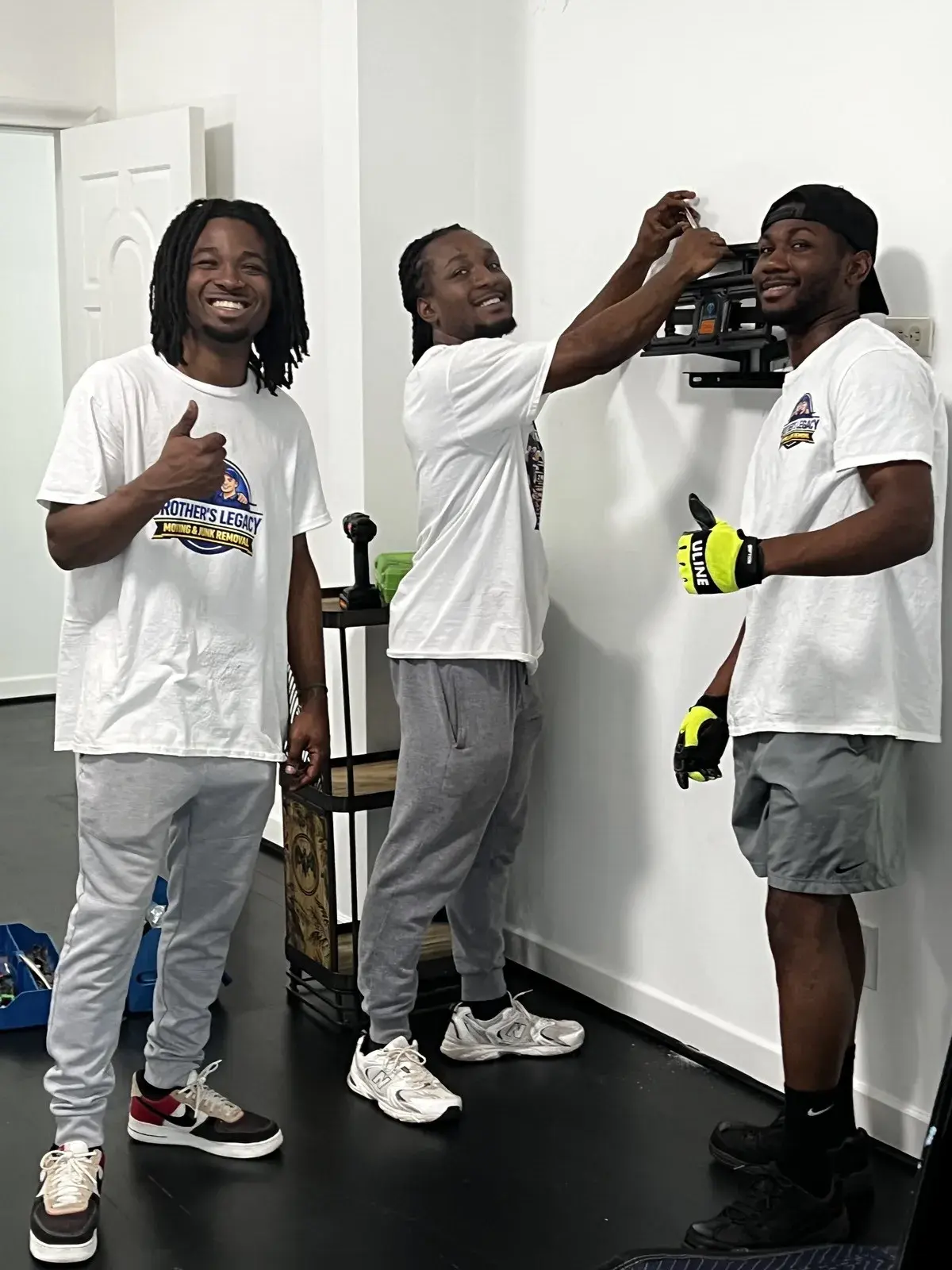 The Brothers Legacy crew in branded shirts