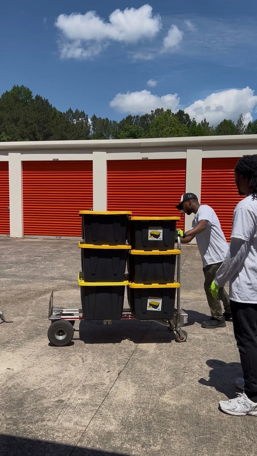 Crew moving totes at a storage facility